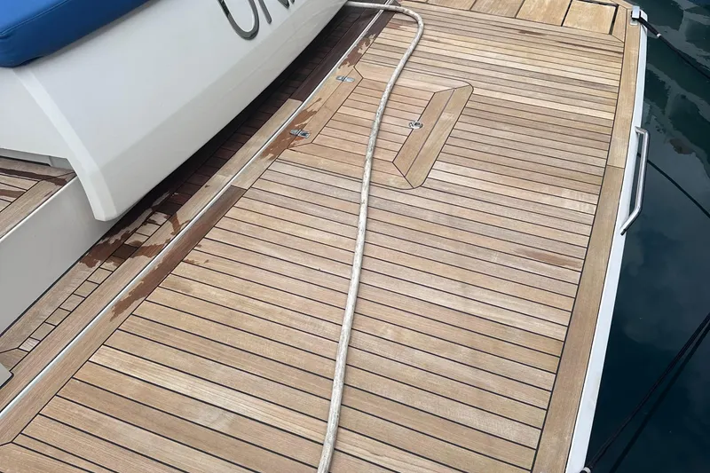 Slide: The Image of Teak deck of 2020 Fjord 44 Open yacht with rope and water stains. - 75