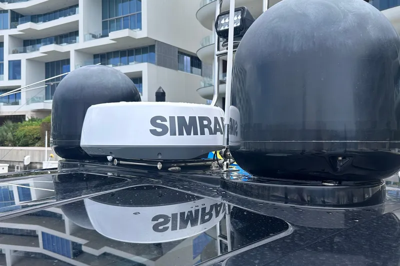 Slide: The Image of Simrad radar equipment on 2020 Fjord 44 Open yacht, with modern building backdrop. - 77