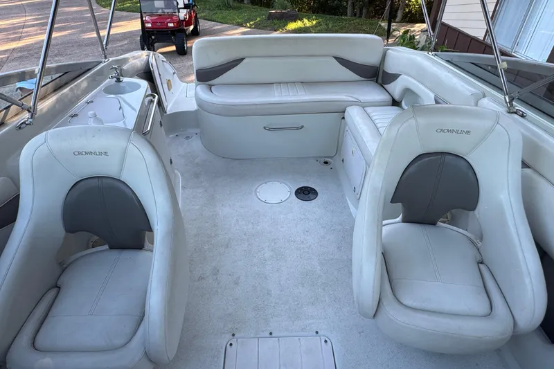 Slide: The Image of 2002 Crownline 239 DB boat with Mercury outboard motor and propeller on display. - 10