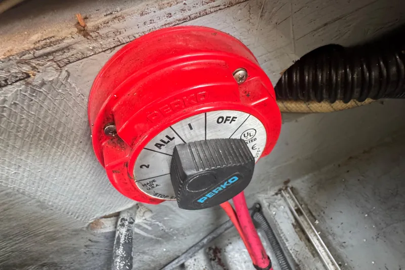 Slide: The Image of Red Perko battery switch on 2002 Crownline 239 DB boat. - 26