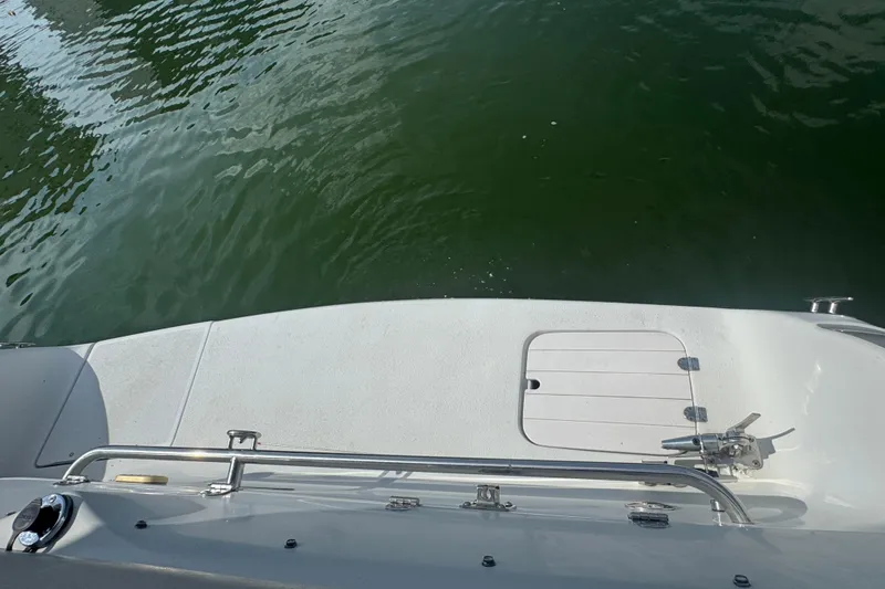 Slide: The Image of 2002 Crownline 239 DB boat deck with water view. - 28