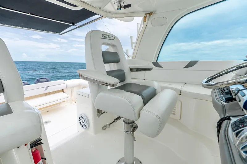 Slide: The Image of 2012 Boston Whaler 345 Conquest helm with ocean view and luxury seating. - 30