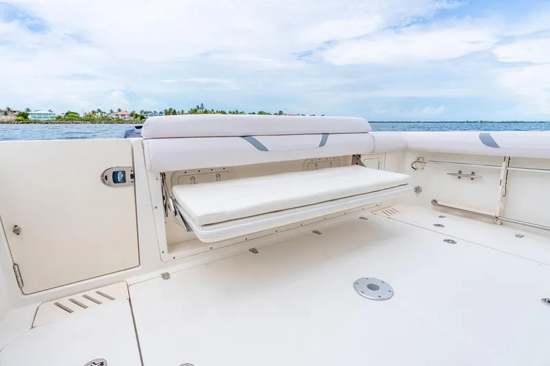 Slide: The Image of 2012 Boston Whaler 345 Conquest boat deck with fold-out seating, ocean view. - 33