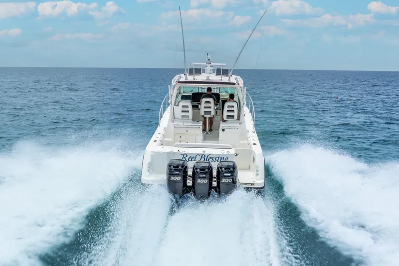 Slide: The Image of Boston Whaler 345 Conquest 2012 cruising on open sea with powerful engines. - 6