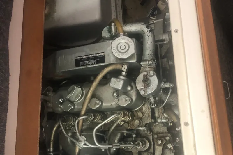 Slide: The Image of Engine compartment of a 1996 Catalina 30 MkIII sailboat, showing mechanical components. - 20