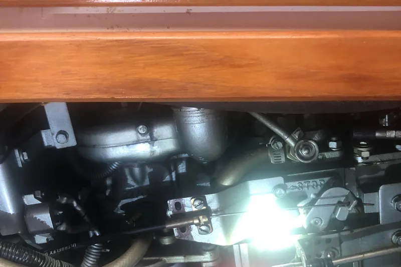 Slide: The Image of Engine compartment of a 1996 Catalina 30 MkIII sailboat, showcasing mechanical components. - 22