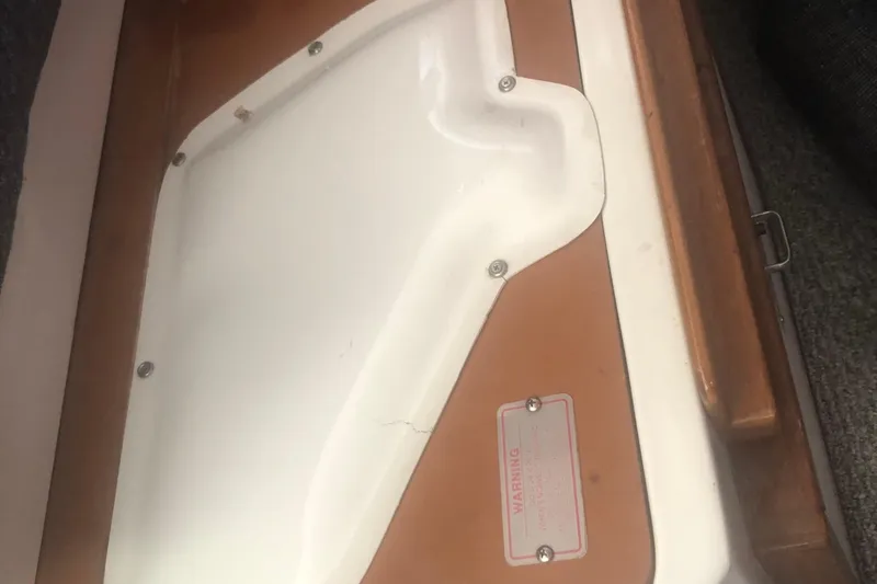 Slide: The Image of 1996 Catalina 30 MkIII interior detail with wooden trim and warning label. - 23