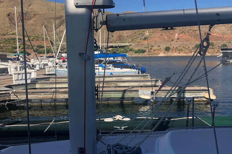 Slide: The Image of Catalina 30 MkIII sailboat docked at a marina, surrounded by scenic hills. - 31