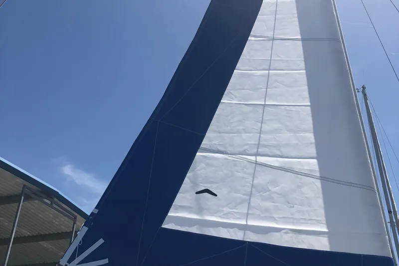 Slide: The Image of Sail of a 1996 Catalina 30 MkIII against a clear blue sky. - 33