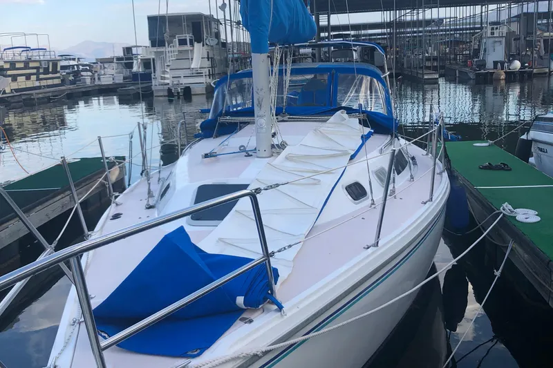 Slide: The Image of 1996 Catalina 30 MkIII sailboat docked at marina with blue sail cover. - 40