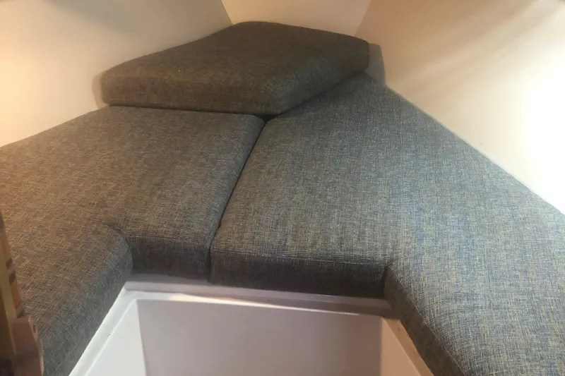 Slide: The Image of Interior cabin view of a 1996 Catalina 30 MkIII sailboat with cushioned seating. - 44