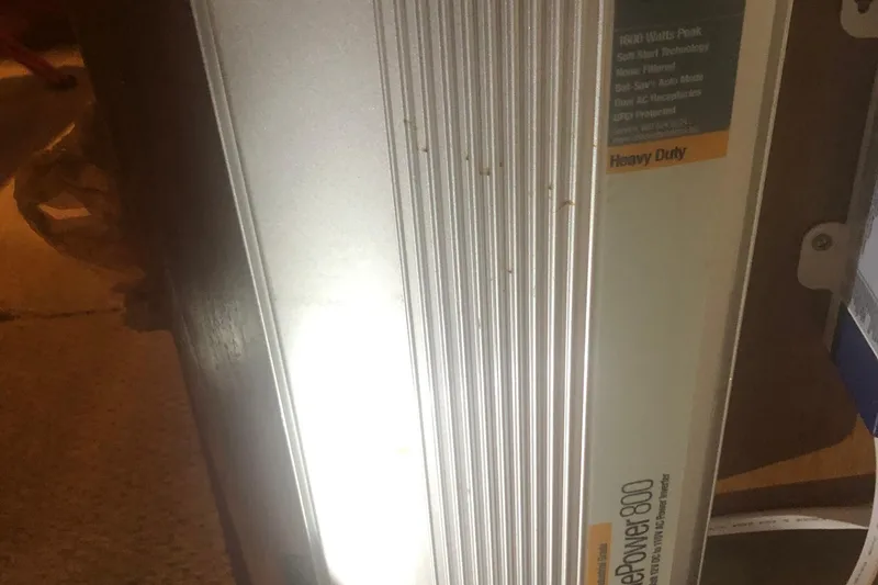 Slide: The Image of Heavy-duty power inverter with ribbed design, labeled "ProPower 800," partially illuminated in dim lighting. - 45