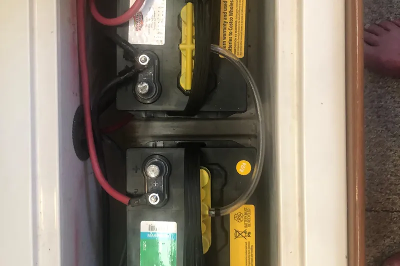 Slide: The Image of Two marine batteries in a 1996 Catalina 30 MkIII sailboat compartment. - 48