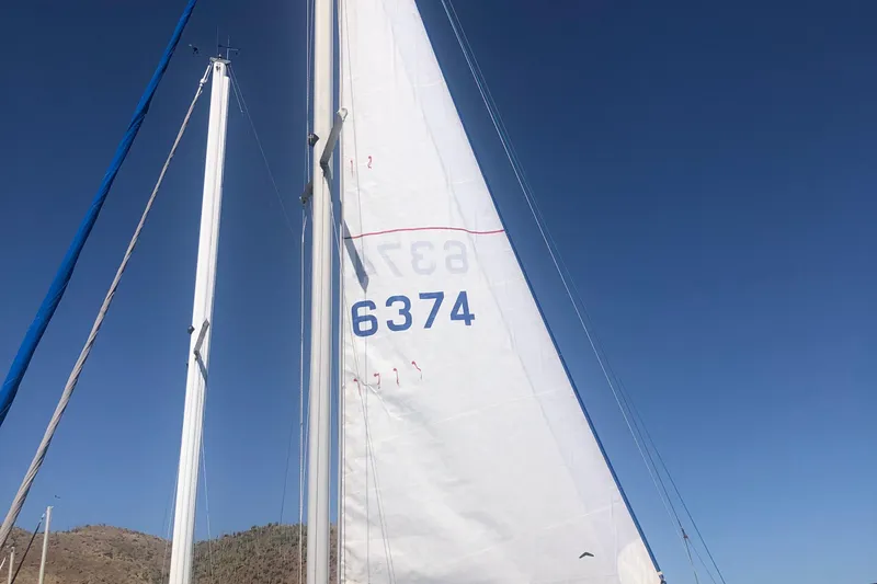 Slide: The Image of Sailboat mast and sail of 1996 Catalina 30 MkIII against clear blue sky. - 49