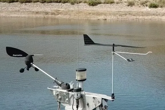 Slide: The Image of Wind instruments on a 1996 Catalina 30 MkIII sailboat, near a calm shoreline. - 53