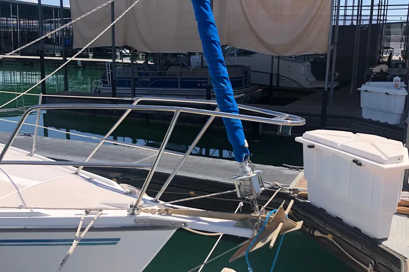 Slide: The Image of 1996 Catalina 30 MkIII sailboat docked, featuring bow and anchor details. - 58