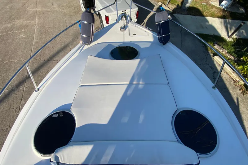 Slide: The Image of 2009 Century 3200 Offshore boat deck with cushions and railings, viewed from above. - 11