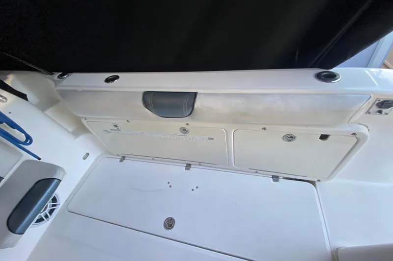 Slide: The Image of 2009 Century 3200 Offshore boat interior with storage compartments and seating. - 19