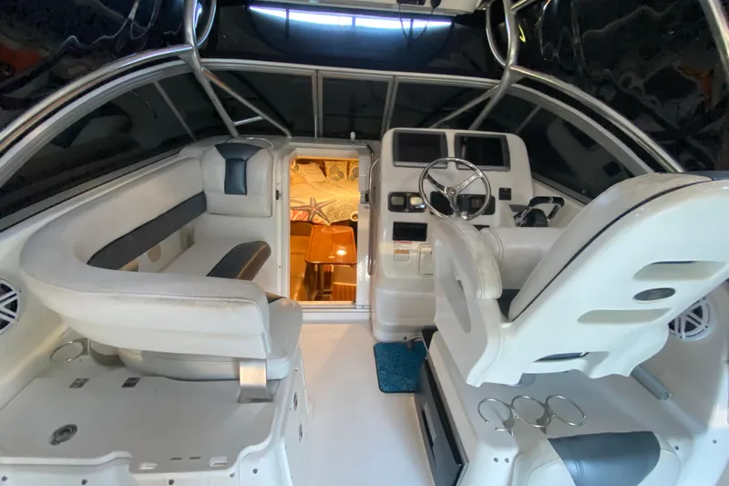 Slide: The Image of Interior of 2009 Century 3200 Offshore boat with seating and helm station. - 21
