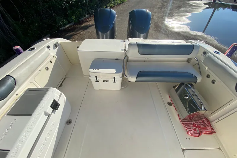 Slide: The Image of 2009 Century 3200 Offshore boat interior with seating and storage compartments. - 36