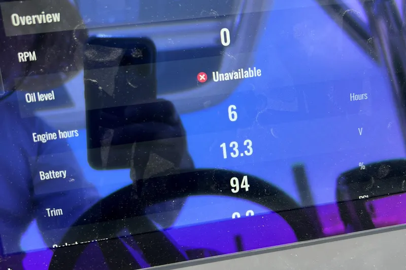 Slide: The Image of Interior view of 2025 Nimbus Tender 8 boat with modern helm and seating. - 8