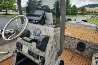 Slide: The Image of 2019 Edge Duck Boats 863 CC with camo design and modern dashboard controls. - 10