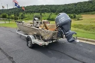 Slide: The Image of 2019 Edge Duck Boats 863 CC on trailer with Yamaha outboard motor, parked on asphalt. - 3