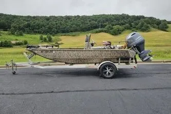Slide: The Image of 2019 Edge Duck Boats 863 CC on trailer, parked on road with scenic countryside background. - 4