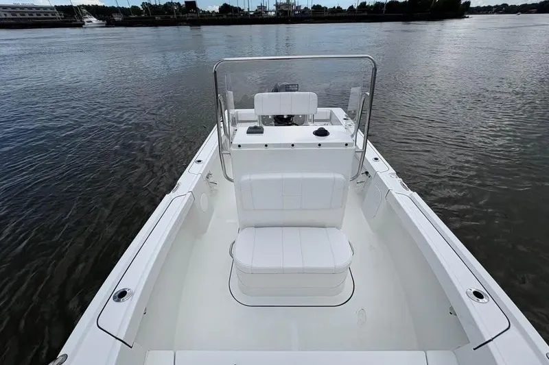 Slide: The Image of 2026 Parker 18SE Center Console boat on calm water, showcasing sleek design and spacious seating. - 14