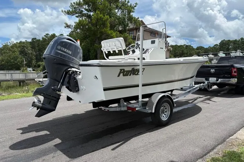 Slide: The Image of 2026 Parker 18SE Center Console boat on trailer, featuring Yamaha outboard motor. - 2