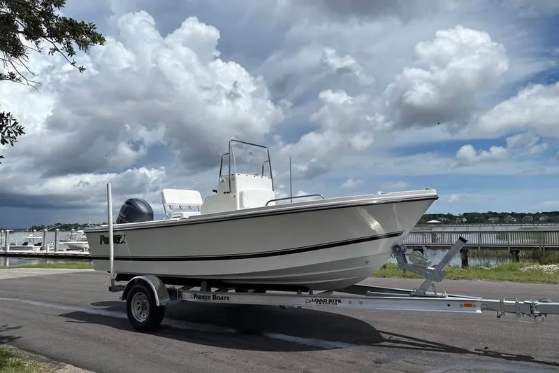 Slide: The Image of 2026 Parker 18SE Center Console boat on trailer, cloudy sky background. - 3