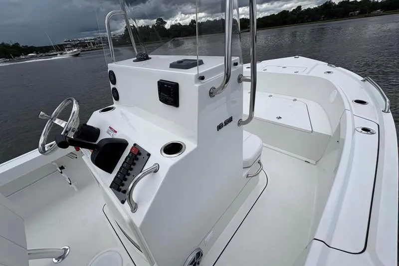 Slide: The Image of 2026 Parker 18SE Center Console boat on calm water, featuring sleek design and modern controls. - 5