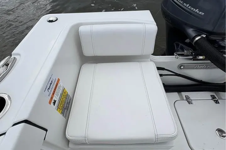 Slide: The Image of White seat on 2026 Parker 18SE Center Console boat, near water. - 7