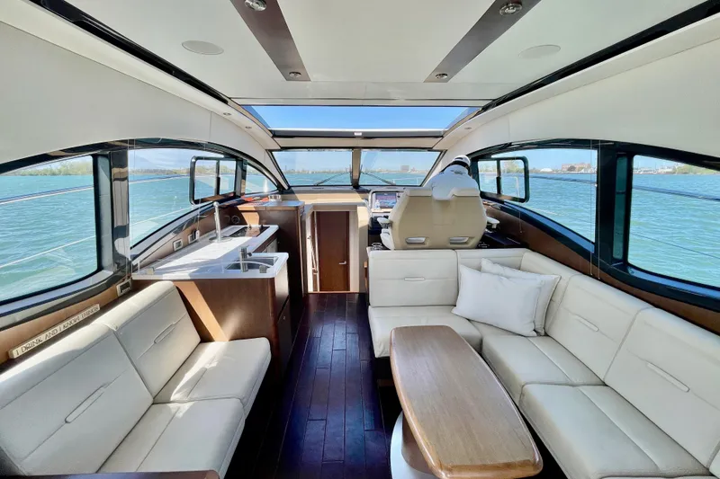 Slide: The Image of Luxurious interior of 2017 Sea Ray Sundancer 400 yacht with elegant seating and panoramic windows. - 11