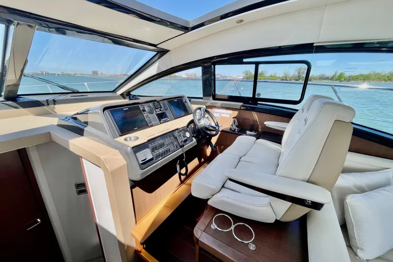 Slide: The Image of Luxurious 2017 Sea Ray Sundancer 400 yacht interior with modern helm and panoramic windows. - 17