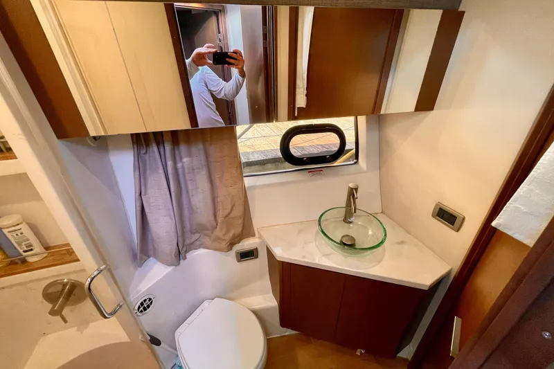 Slide: The Image of Bathroom interior of 2017 Sea Ray Sundancer 400 yacht with modern fixtures and mirror. - 21