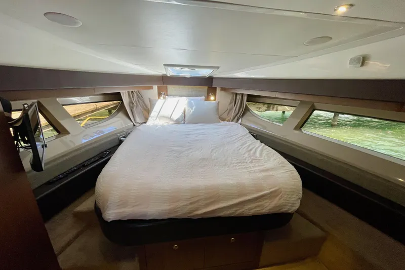 Slide: The Image of Luxurious 2017 Sea Ray Sundancer 400 yacht bedroom with elegant bedding and panoramic windows. - 25