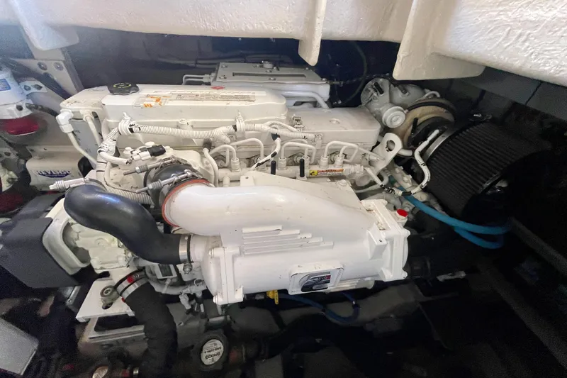 Slide: The Image of Engine compartment of a 2017 Sea Ray Sundancer 400, showcasing detailed mechanical components. - 30