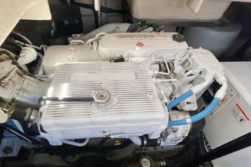 Slide: The Image of Engine compartment of a 2017 Sea Ray Sundancer 400, showcasing detailed mechanical components. - 31