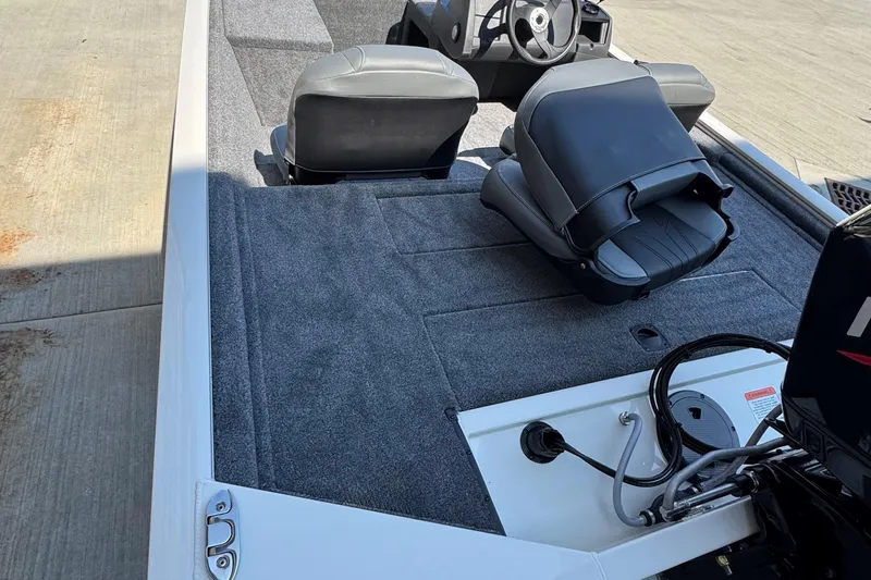 Slide: The Image of 2026 Tracker Pro 170 boat interior with gray carpet and seating. - 63