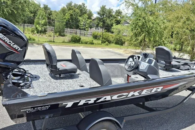 Slide: The Image of 2026 Tracker Pro Team 175 boat with Mercury engine, parked outdoors. - 61