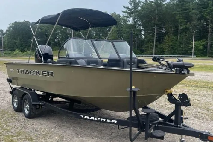 Slide: The Image of 2026 Tracker Targa V-18 Combo boat on trailer, parked outdoors. - 2