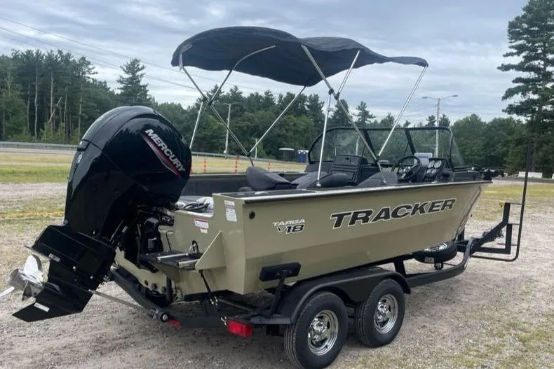 Slide: The Image of 2026 Tracker Targa V-18 Combo boat on trailer with canopy and Mercury engine. - 5