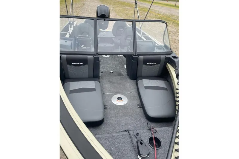 Slide: The Image of 2026 Tracker Targa V-18 Combo boat interior with dual seats and windshield. - 6