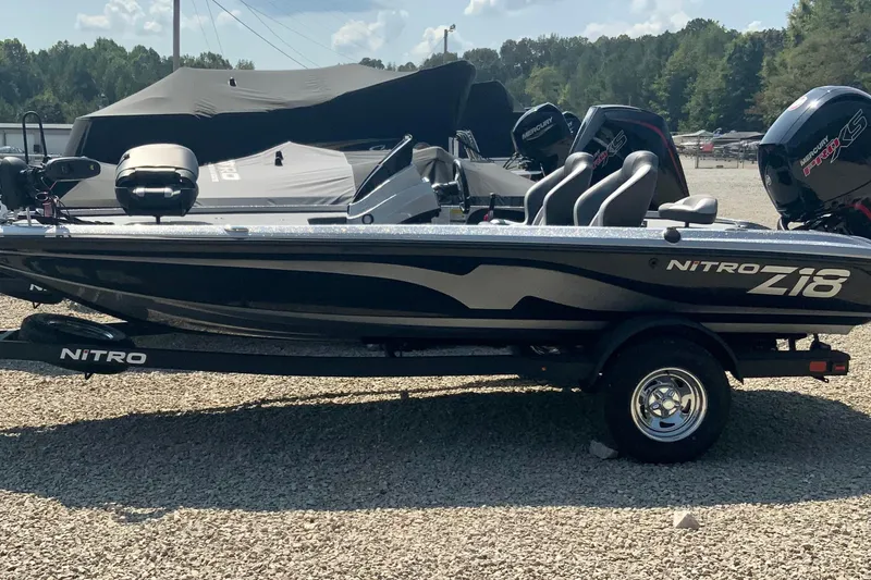 The Image of 2026 Nitro Z18 Pro boat on trailer, parked outdoors under clear sky. - 0