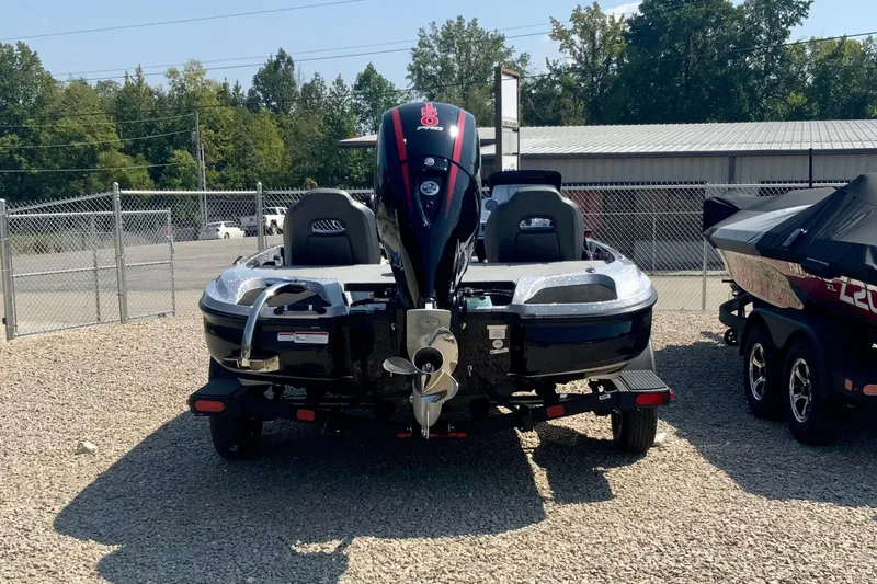 Slide: The Image of 2026 Nitro Z18 Pro boat on trailer, parked on gravel lot, rear view. - 3