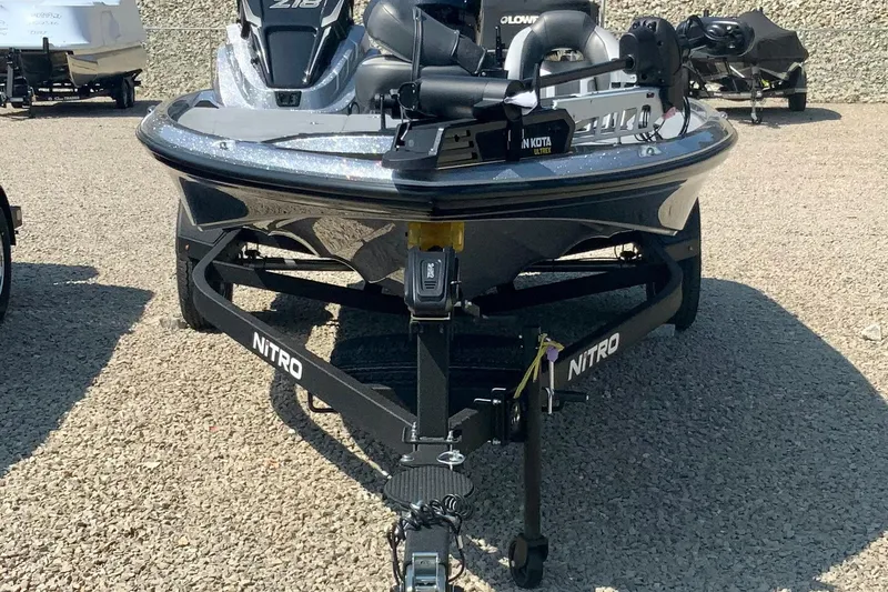 Slide: The Image of 2026 Nitro Z18 Pro boat on trailer, parked on gravel surface. - 6