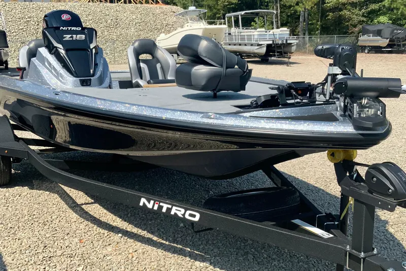 Slide: The Image of 2026 Nitro Z18 Pro boat on trailer, parked on gravel lot. - 9