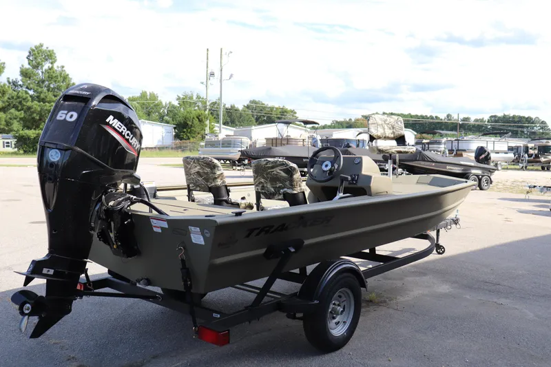 Slide: The Image of 2026 Tracker Grizzly 1754 SC boat with Mercury 50 engine on trailer. - 9
