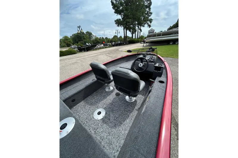 Slide: The Image of 2026 Tracker Super Guide V-16 SC boat interior with dual seats and steering console. - 47